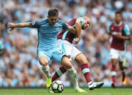 MANCHESTER, ENGLAND - AUGUST 28: John Stones of Manchester City is challenged by Gokhan Tore of West Ham United during the Premier League match between Manchester City and West Ham United at Etihad Stadium on August 28, 2016 in Manchester, England. (Photo by Chris Brunskill/Getty Images)