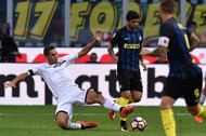 MILAN, ITALY - AUGUST 28: Ivaylo Chochev (R) of Palermo and Ever Banega of Internazionale compete for the ball during the Seria A match between FC Internazionale and US Citta di Palermo at Stadio Giuseppe Meazza on August 28, 2016 in Milan, Italy. (Photo by Tullio M. Puglia/Getty Images)