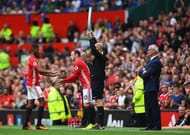MANCHESTER, ENGLAND - SEPTEMBER 24: Marcus Rashford of Manchester United (L) comes off for Wayne Rooney of Manchester United (R) during the Premier League match between Manchester United and Leicester City at Old Trafford on September 24, 2016 in Manchester, England. (Photo by Laurence Griffiths/Getty Images)