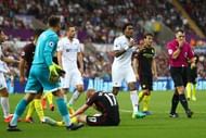 SWANSEA, WALES - SEPTEMBER 24: Leroy Fer of Swansea City (C) argues with referee Neil Swarbrick after he awarded Manchester City a penalty for a foul on Kevin De Bruyne of Manchester City during the Premier League match between Swansea City and Manchester City at the Liberty Stadium on September 24, 2016 in Swansea, Wales. (Photo by Michael Steele/Getty Images)