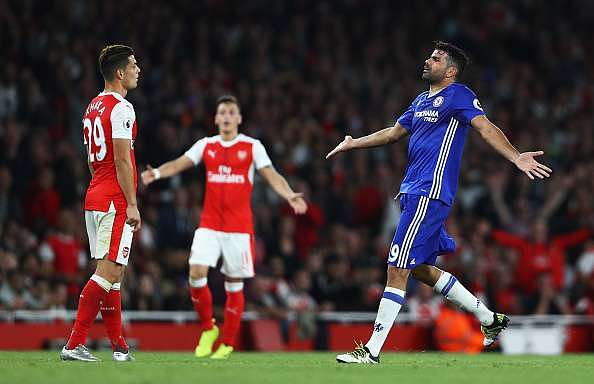 LONDON, ENGLAND - SEPTEMBER 24: Granit Xhaka of Arsenal (L) and Diego Costa of Chelsea (R) confront each other  during the Premier League match between Arsenal and Chelsea at the Emirates Stadium on September 24, 2016 in London, England.  (Photo by Paul Gilham/Getty Images)