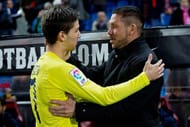 MADRID, SPAIN - DECEMBER 14: Head coach Diego Pablo Simeone (R) of Atletico de Madrid embraces Luciano Dario Vietto (L) of Villarreal CF prior to start the La Liga match between Club Atletico de Madrid and Villarreal CF at Vicente Calderon Stadium on December 14, 2014 in Madrid, Spain. (Photo by Gonzalo Arroyo Moreno/Getty Images)