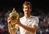 LONDON, ENGLAND - JULY 10: Andy Murray of Great Britain lifts the trophy following victory in the Men's Singles Final against Milos Raonic of Canada on day thirteen of the Wimbledon Lawn Tennis Championships at the All England Lawn Tennis and Croquet Club on July 10, 2016 in London, England. (Photo by Julian Finney/Getty Images)