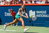 MONTREAL, ON - JULY 31: Madison Keys of the United States hits a return against Simona Halep of Romania during day seven in final round action of the Rogers Cup at Uniprix Stadium on July 31, 2016 in Montreal, Quebec, Canada. (Photo by Minas Panagiotakis/Getty Images)