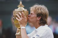 Stefan Edberg of Sweden kisses trophy as he celebrates defeating Boris Becker in the Men's Singles Final of the Wimbledon Lawn Tennis Championship on 4 July 1988 at the All England Lawn Tennis and Croquet Club in Wimbledon, London, England. (Photo by Steve Powell/Getty Images)