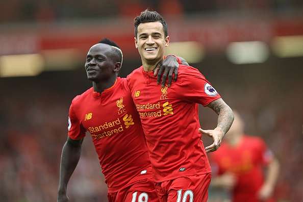 LIVERPOOL, ENGLAND - SEPTEMBER 24:  Philippe Coutinho of Liverpool celebrates with Sadio Mane as he scores their fourth goal during the Premier League match between Liverpool and Hull City at Anfield on September 24, 2016 in Liverpool, England.  (Photo by Julian Finney/Getty Images)
