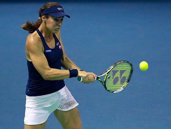 WUHAN, CHINA - SEPTEMBER 29:  Martina Hingis of Switzerland and CoCo Vandeweghe of United States (not in picture) in action against Aleksandra Krunic of Serbia and Katerina Siniakova of Czech Republic on Day 5 of the 2016 Dongfeng Motor Wuhan Open at the Optics Valley International Tennis Center on September 29, 2016 in Wuhan, China.  (Photo by Kevin Lee/Getty Images)