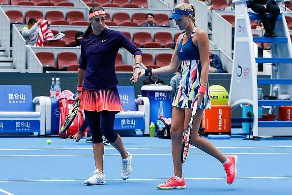 BEIJING, CHINA - OCTOBER 09:  Caroline Garcia of France and Kristina Mladenovic of France check hands against Bethanie Mattek-Sands of United States and Lucie Safarova of Czech Republic during the Womens doubles final on day nine of the 2016 China Open at the China National Tennis Centre on October 9, 2016 in Beijing, China.  (Photo by Etienne Oliveau/Getty Images)