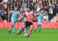SOUTHAMPTON, ENGLAND - OCTOBER 16: Charlie Austin of Southampton scores their third goal from the penalty spot during the Premier League match between Southampton and Burnley at St Mary's Stadium on October 16, 2016 in Southampton, England. (Photo by Mike Hewitt/Getty Images)