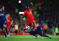 LIVERPOOL, ENGLAND - OCTOBER 17: Sadio Mane of Liverpool skips past Eric Bailly of Manchester United during the Premier League match between Liverpool and Manchester United at Anfield on October 17, 2016 in Liverpool, England. (Photo by Clive Brunskill/Getty Images)