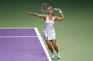 SINGAPORE - OCTOBER 23: Angelique Kerber of Germany serves in her singles match against Dominika Cibulkova of Slovakia during day 1 of the BNP Paribas WTA Finals Singapore at Singapore Sports Hub on October 23, 2016 in Singapore. (Photo by Julian Finney/Getty Images)