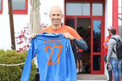 Indian cricket star Ajinkya Rahane and FC Bayern Munich's Arjen Robben exchange gifts on Diwali
