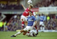 13 Mar 1999: Ray Parlour of Arsenal is challenged by Marco Materazzi of Everton in the FA Carling Premiership match at Goodison Park in Liverpool, England. Arsenal won 2-0. \ Mandatory Credit: Clive Brunskill /Allsport