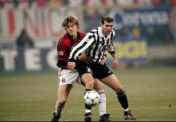 6 Jan 1999:  Zinedine Zidane of Juventus is challenged by Thomas Helveg of AC Milan during the Italian Serie A match at the San Siro Stadium in Milan, Italy. The game ended in a 1-1 draw. \ Mandatory Credit: Allsport UK /Allsport