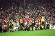 Arsenal and Manchester United players fight