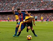 Barca held at home by nine-man Malaga