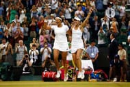LONDON, ENGLAND - JULY 11: Sania Mirza of India and Martina Hingis of Switzerland celebrate after winning the Final of the Ladies Doubles against Ekaterina Makarova and Elena Vesnina of Russia during the day twelve of the Wimbledon Lawn Tennis Championships at the All England Lawn Tennis and Croquet Club on July 11, 2015 in London, England. (Photo by Julian Finney/Getty Images)