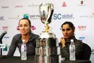 SINGAPORE - NOVEMBER 01: Martina Hingis of Switzerland and Sania Mirza of India speak at a press conference with the Martina Navratilova Doubles Trophy after defeating Carla Suarez Navarro and Garbine Muguruza of Spain in the doubles final match during the BNP Paribas WTA Finals at Singapore Sports Hub on November 1, 2015 in Singapore. (Photo by Clive Brunskill/Getty Images)