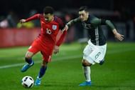 BERLIN, GERMANY - MARCH 26: Dele Alli of England battles with Mesut Ozil of Germany during an International friendly between Germany and England at Olympiastadion on March 26, 2016 in Berlin, Germany. (Photo by Mike Hewitt/Getty Images)