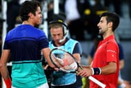 MADRID, SPAIN - MAY 06: Novak Djokovic of Serbia shakes hands at the net after his straight set victory against Milos Raonic of Canada in their quarter final round match during day seven of the Mutua Madrid Open tennis tournament at the Caja Magica on May 06, 2016 in Madrid,Spain. (Photo by Clive Brunskill/Getty Images)