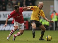 LONDON - DECEMBER 26: Pascal Cygan of Arsenal holds back the challenge from Radostin Kishishev of Charlton during the Barclays Premiership match between Charlton and Arsenal at The Valley on December 26, 2005 in London, England. (Photo by Jamie McDonald/Getty Images)