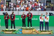 RIO DE JANEIRO, BRAZIL - AUGUST 14: (L-R) Silver medalists Venus Williams and Rajeev Ram of the United States, gold medalists Bethanie Mattek-Sands and Jack Sock of the United States and bronze medalists Lucie Hradecka and Radek Stepanek of the Czech Republic pose on the podium during the ceremony for the mixed doubles on Day 9 of the Rio 2016 Olympic Games at the Olympic Tennis Centre on August 14, 2016 in Rio de Janeiro, Brazil. (Photo by Clive Brunskill/Getty Images)