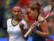 WUHAN, CHINA - OCTOBER 01: Sania Mirza of India and Barbora Strycova of Czech Republic in action against Lucie Safarova of Czech Republic and Bethanie Mattek-Sands of United States during the double final match of 2016 Dongfeng Motor Wuhan Open at Optics Valley International Tennis Center on October 1, 2016 in Wuhan, China. (Photo by Kevin Lee/Getty Images)