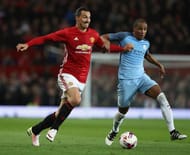 MANCHESTER, ENGLAND - OCTOBER 26: Zlatan Ibrahimovic of Manchester United (L) and Fernando of Manchester City (R) battle for possession during the EFL Cup Fourth Round match between Manchester United and Manchester City at Old Trafford on October 26, 2016 in Manchester, England. (Photo by David Rogers/Getty Images)