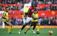 MANCHESTER, ENGLAND - NOVEMBER 19: Alexis Sanchez of Arsenal (R) is pulled back by Paul Pogba of Manchester United (C) during the Premier League match between Manchester United and Arsenal at Old Trafford on November 19, 2016 in Manchester, England. (Photo by Shaun Botterill/Getty Images)