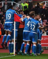 STOKE ON TRENT, ENGLAND - NOVEMBER 19: Nathan Ake of AFC Bournemouth (not seen) celebrates scoring his sides first goal with his AFC Bournemouth team mates during the Premier League match between Stoke City and AFC Bournemouth at Bet365 Stadium on November 19, 2016 in Stoke on Trent, England. (Photo by Gareth Copley/Getty Images)