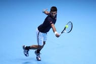 LONDON, ENGLAND - NOVEMBER 20: Novak Djokovic of Serbia hits a backhand during the Singles Final against Andy Murray of Great Britain at the O2 Arena on November 20, 2016 in London, England. (Photo by Julian Finney/Getty Images)