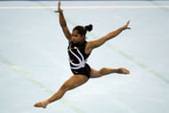 GUANGZHOU, CHINA - NOVEMBER 14: Dipa Karmarkar of India competes in the Women's Team Final floor discipline at the Asian Games Town Gymnasium during day two of the 16th Asian Games Guangzhou 2010 on November 14, 2010 in Guangzhou, China. (Photo by Hannah Peters/Getty Images)