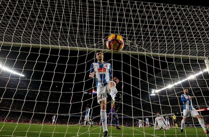Barca cut deficit to Real thanks to magical Messi