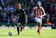 STOKE ON TRENT, ENGLAND - APRIL 18: Morgan Schneiderlin of Southampton competes with Steven Nzonzi of Stoke during the Barclays Premier League match between Stoke City and Southampton at the Britannia Stadium on April 18, 2015 in Stoke on Trent, England. (Photo by Jan Kruger/Getty Images)