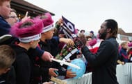 TAUNTON, UNITED KINGDOM - JUNE 10: Chris Gayle of Somerset signs autographs for fans during the Natwest T20 Blast match between Somerset and Surrey at The Cooper Associates County Ground on June 10, 2016 in Somerset, United Kingdom. (Photo by Harry Trump/Getty Images)