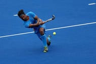 RIO DE JANEIRO, BRAZIL - AUGUST 08: Rupinder Pal Singh #3 of India passes the ball against Germany during a Men's Pool B match on Day 3 of the Rio 2016 Olympic Games at the Olympic Hockey Centre on August 8, 2016 in Rio de Janeiro, Brazil. (Photo by Sean M. Haffey/Getty Images)