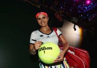 SINGAPORE - OCTOBER 28: Sania Mirza of India signs a tennis ball after partnering Martina Hingis of Switzerland in their doubles match against Hao-Ching Chan and Yung-Jan Chan of Republic of China during day 6 of the BNP Paribas WTA Finals Singapore at Singapore Sports Hub on October 28, 2016 in Singapore. (Photo by Julian Finney/Getty Images)