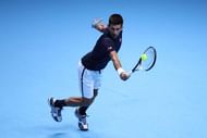 LONDON, ENGLAND - NOVEMBER 20: Novak Djokovic of Serbia hits a backhand during the Singles Final against Andy Murray of Great Britain at the O2 Arena on November 20, 2016 in London, England. (Photo by Julian Finney/Getty Images)