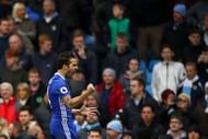 MANCHESTER, ENGLAND - DECEMBER 03: Cesc Fabregas of Chelsea celebrates his team's third goal scored by Eden Hazard (not pictured) during the Premier League match between Manchester City and Chelsea at Etihad Stadium on December 3, 2016 in Manchester, England. (Photo by Clive Brunskill/Getty Images)