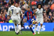 BARCELONA, SPAIN - DECEMBER 03: Lionel Messi of Barcelona and Cristiano Ronaldo of Real Madrid compete for the ball during the La Liga match between FC Barcelona and Real Madrid CF at Camp Nou on December 3, 2016 in Barcelona, Spain. (Photo by David Ramos/Getty Images)