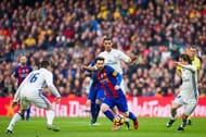 BARCELONA, SPAIN - DECEMBER 03: Lionel Messi (C) of FC Barcelona conducts the ball between Mateo Kovacic (L), Cristiano Ronaldo (2nd R) and Luka Modric (R) of Real Madrid CF during the La Liga match between FC Barcelona and Real Madrid CF at Camp Nou stadium on December 3, 2016 in Barcelona, Spain. (Photo by Alex Caparros/Getty Images)