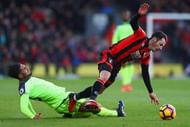 BOURNEMOUTH, ENGLAND - DECEMBER 04: Adam Smith of AFC Bournemouth is tackled by Emre Can of Liverpool during the Premier League match between AFC Bournemouth and Liverpool at Vitality Stadium on December 4, 2016 in Bournemouth, England. (Photo by Michael Steele/Getty Images)