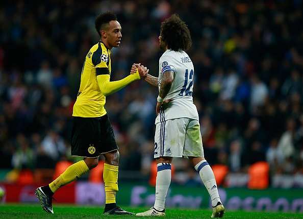 MADRID, SPAIN - DECEMBER 07: Pierre-Emerick Aubameyang of Borussia Dortmund (L) and Marcelo of Real Madrid (R) embrace after the final whistle during the UEFA Champions League Group F match between Real Madrid CF and Borussia Dortmund at the Bernabeu on December 7, 2016 in Madrid, Spain.  (Photo by Gonzalo Arroyo Moreno/Getty Images)