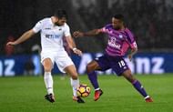 SWANSEA, WALES - DECEMBER 10: Jordi Amat of Swansea City (L) attempts to tackle Jermain Defoe of Sunderland (R) during the Premier League match between Swansea City and Sunderland at the Liberty Stadium on December 10, 2016 in Swansea, Wales. (Photo by Stu Forster/Getty Images)