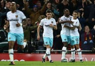 LIVERPOOL, ENGLAND - DECEMBER 11: Michail Antonio (2nd R) of West Ham United celebrates scoring his team's second goal with his team mates Manuel Lanzini (1st R) during the Premier League match between Liverpool and West Ham United at Anfield on December 11, 2016 in Liverpool, England. (Photo by Jan Kruger/Getty Images)