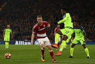 MIDDLESBROUGH, ENGLAND - DECEMBER 14: Divock Origi of Liverpool (R) shoots during the Premier League match between Middlesbrough and Liverpool at Riverside Stadium on December 14, 2016 in Middlesbrough, England. (Photo by Jan Kruger/Getty Images)