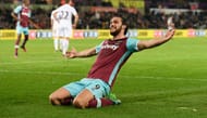 SWANSEA, WALES - DECEMBER 26: West Ham striker Andy Carroll celebrates after scoring the fourth West Ham goal during the Premier League match between Swansea City and West Ham United at Liberty Stadium on December 26, 2016 in Swansea, Wales. (Photo by Stu Forster/Getty Images)