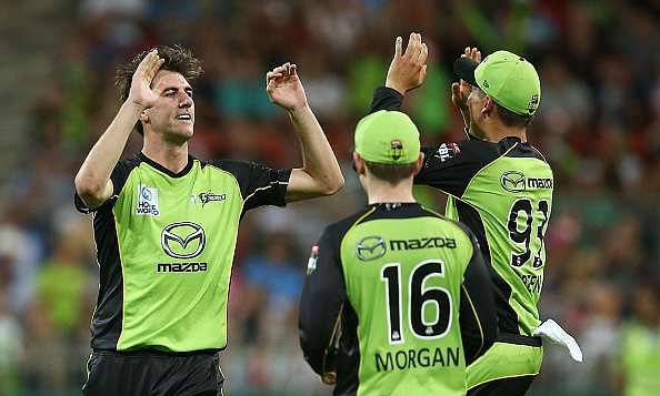 SYDNEY, AUSTRALIA - DECEMBER 28:  Pat Cummins of the Thunder celebrates with team mates after taking the wicket of Brendon McCullum of the Heat during the Big Bash League match between the Sydney Thunder and Brisbane Heat at Spotless Stadium on December 28, 2016 in Sydney, Australia.  (Photo by Mark Metcalfe/Getty Images)