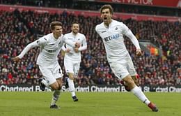 Soccer-Liverpool title challenge dented by Swansea sensation