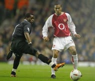LONDON - DECEMBER 2: Henri Camara of Wolverhampton Wanderers tries to tackle Gael Clichy of during the Carling Cup fourth round match between Arsenal and Wolverhampton Wanderers at Highbury on December 2, 2003 in London. (Photo by Clive Mason/Getty Images)